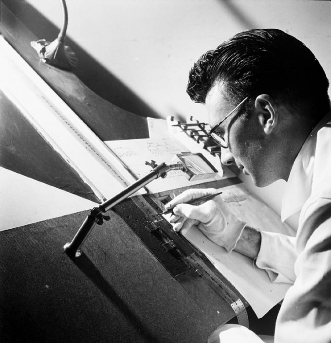 Norman McLaren, of the animation department, National Film Board of Canada, drawing directly on film in 1944.