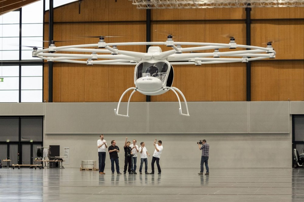 A cheer goes up from the Evolo company crowd as the Volocopter 200 makes its maiden public test flight.